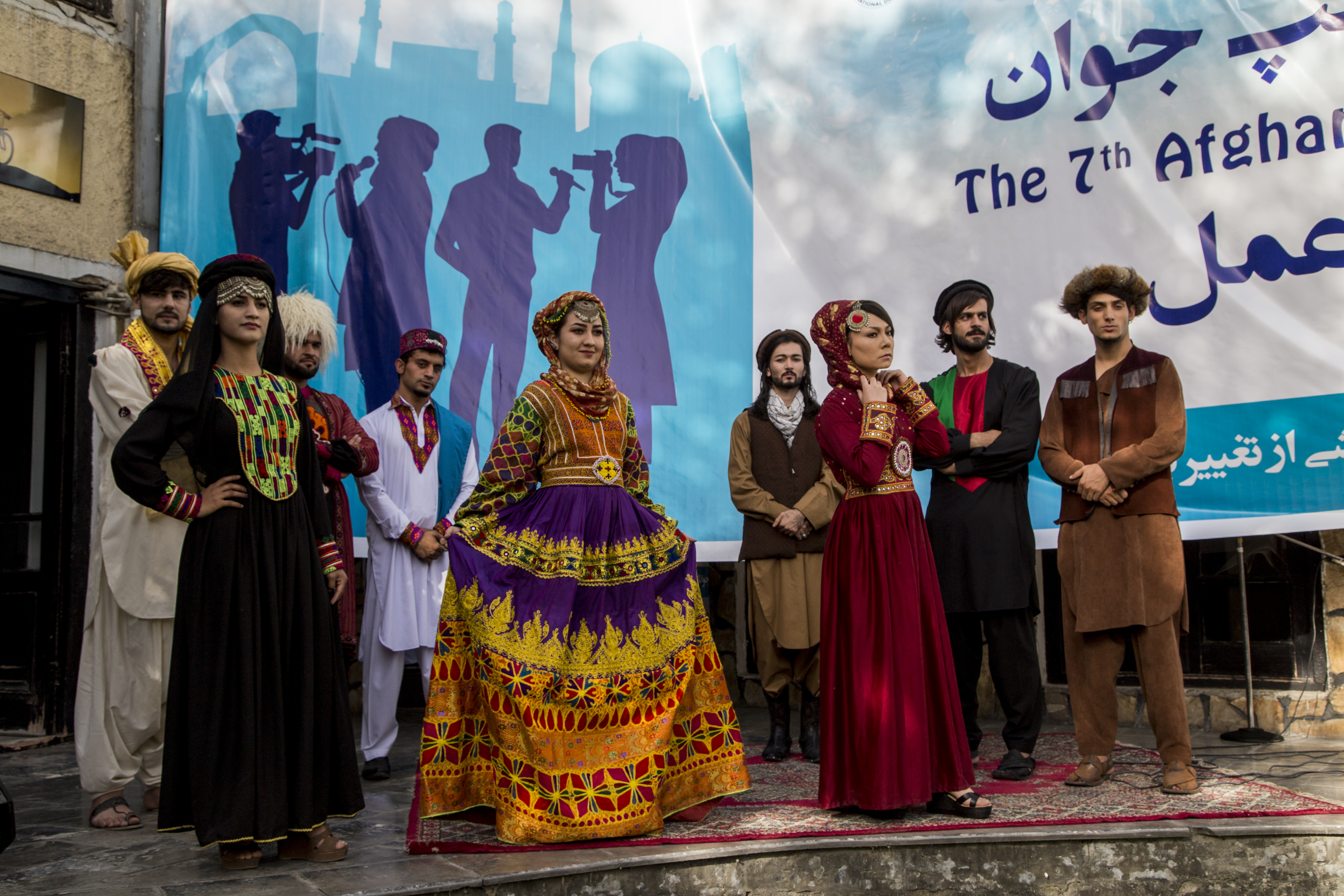 Dancers in traditional dress on the stage at the Festival.
