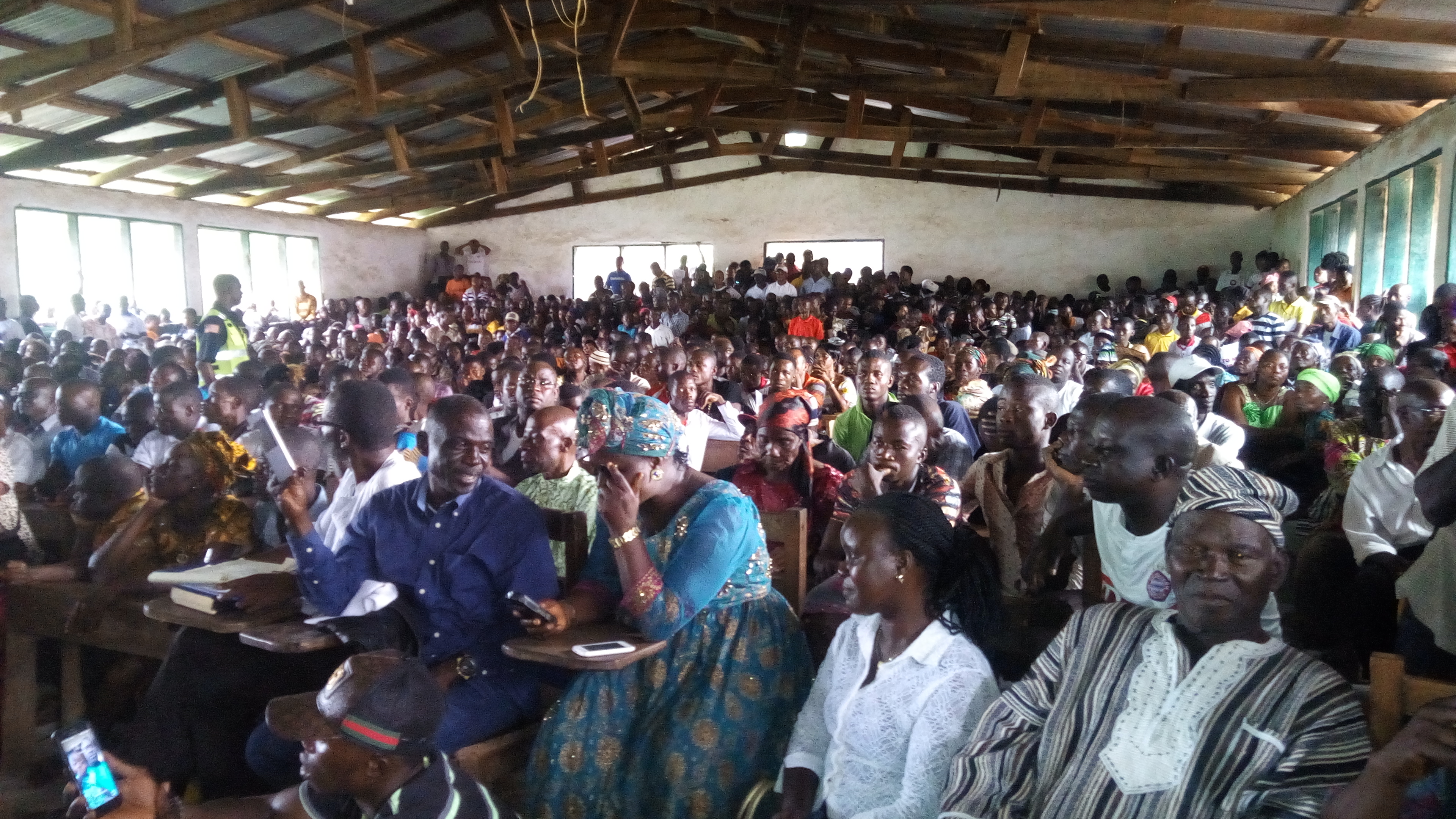 A large group of people seated watching the stage